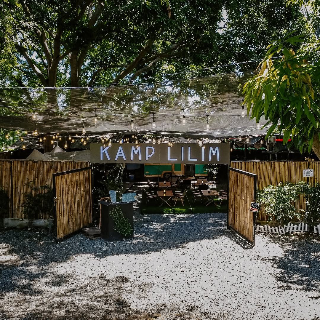 Kamp Lilim entrance from the street — daytime wide shot