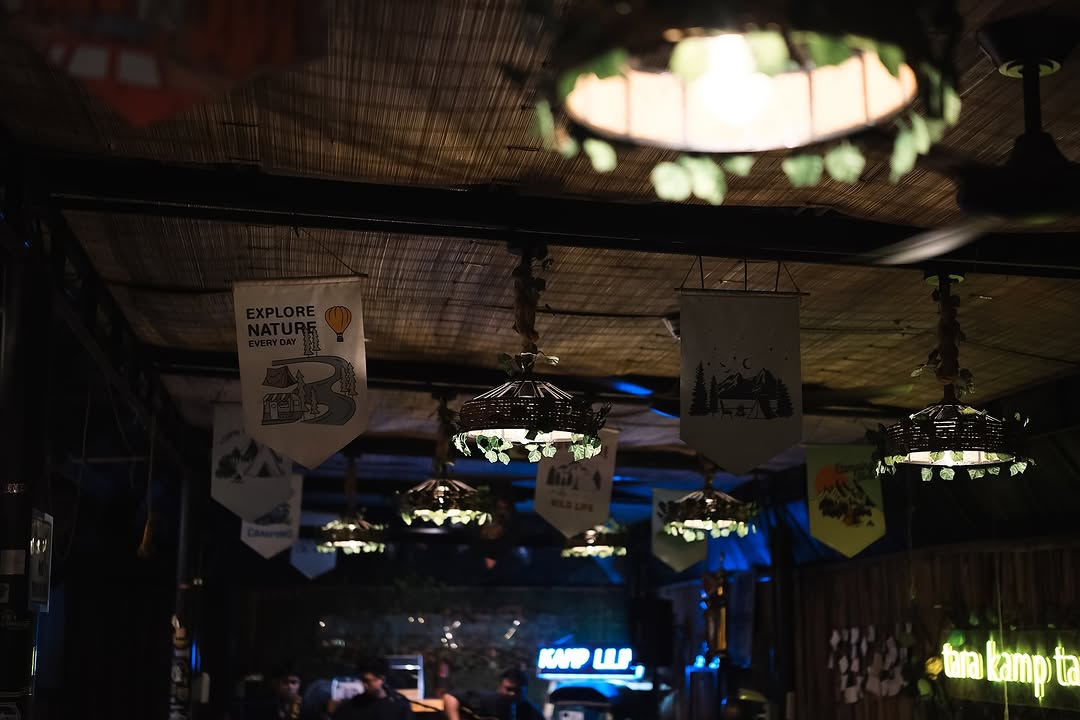 Kamp Lilim ceiling with adventure pennant banners and hanging lanterns